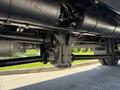 The underside view of a 2009 International 3000 CE showing the axle and various mechanical components in a black finish