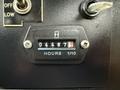 A close-up view of a digital hour meter displaying 04487.8 hours with two knobs, one labeled "OFF" and "LOW"