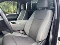 Interior of a 2020 Ford F-150 showing two front seats with gray upholstery and a center console between them
