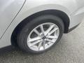 A close-up view of the wheel and tire of a 2018 Ford Focus showcasing the silver alloy rim and branded tire with visible tread patterns