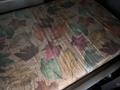 A 2009 Peterbilt Highway model featuring a mattress covered in a patterned fabric with various colorful leaves