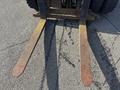 Close-up of the fork blades of a 1993 Hyster H80XL forklift showing rust and wear on the metal surface