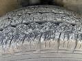 Close-up of a worn tire with visible tread patterns on a 2017 Ford Transit vehicle