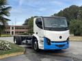 A 2020 Lion Lion6 electric truck in white and blue featuring a modern design with a prominent front grille and large headlights with no cargo bed attached