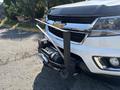 A 2017 Chevrolet Colorado with a winch mounted on the front bumper showcasing the vehicle's chrome grille and logo