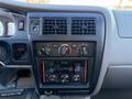 Interior dashboard of a 2004 Toyota Tacoma featuring air conditioning controls and a Pioneer stereo system