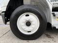 A close-up of a 2005 Freightliner M2 106 truck wheel featuring a white rim and a black Goodyear Marathon tire