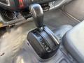 Gear shift of a 2014 Hino 195 with markings for park reverse neutral and drive positioned on a console