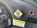 A dashboard control for the parking brake in a 2012 Autocar Xpert with labels indicating pull to apply and push to release functions