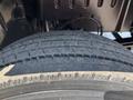 Close-up of a worn tire on a 2007 GMC C4500 TopKick showing tread patterns and dirt accumulation