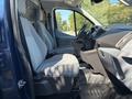 2016 Ford Transit 150 interior view showing two gray front seats and dashboard without people inside