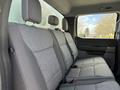 Interior view of the back seat of a 2024 Ford F-550 featuring gray upholstery and headrests