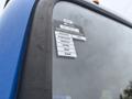 A close-up of a sticker on the window of a 2017 Autocar Xpert displaying certification information with months listed from January to July