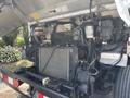 2011 Workhorse W62 engine compartment showing the radiator and various mechanical components with exposed wiring and hoses