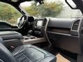 Interior of a 2018 Ford F-150 with leather seats and a modern dashboard displaying controls and technology features