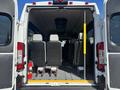 The interior of a 2020 RAM ProMaster 3500 showing three passenger seats facing forward with a fire extinguisher attached to the side