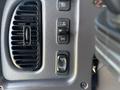 Control panel of a 2019 Freightliner M2 106 featuring various switches including a fan control and buttons for dashboard lighting adjustments