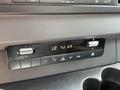 2023 Mercedes-Benz Sprinter dashboard control panel with various knobs and buttons for climate control and audio settings