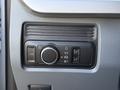 Control panel of a 2024 Ford F-550 featuring various knobs and buttons for adjusting vehicle settings