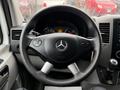 Steering wheel of a 2017 Mercedes-Benz Sprinter featuring the brand logo and various control buttons