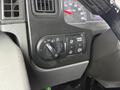 Close-up of the control panel in a 2020 International MV607 featuring various dials and buttons for adjusting vehicle settings and indicators