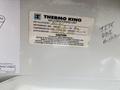 Label on a Thermo King air conditioning unit detailing installation information and cautionary notes regarding refrigerant and service requirements