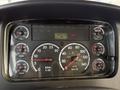 Dashboard of a 2015 Freightliner M2 displaying various gauges including speedometer fuel and engine temperature readings