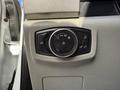Control panel featuring a dial and buttons for adjusting lights in a 2020 Ford F-550