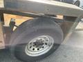 Close-up of a wheel on a 2013 JLG Industries 1014 showing the tire tread and metal rim with visible wear and tear