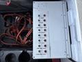 Control panel with labeled switches and indicator lights for various functions including compartment lights and flood lights