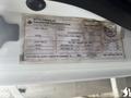 A label on a 2012 International 7300 Workstar detailing specifications such as GVWR, tire size, and cargo carrying capacity