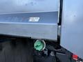 A 2021 RAM 5500 truck showing a close-up of a fuel inlet with a green cap and a sign that reads DIESEL FUEL ONLY