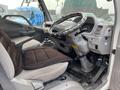 Interior view of a 2005 Toyota Toyoace showing the driver's seat steering wheel gear lever and dashboard