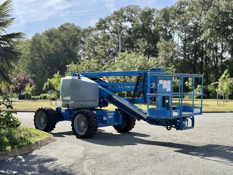 A blue 2012 Genie Z 45/25 aerial lift with a platform attached and four tires visible