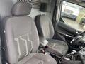Interior of a 2017 Ford Transit Connect showing two front seats and the gear shift with a simple layout