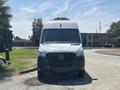A 2019 Mercedes-Benz Sprinter van with a white front exterior and black grille is parked facing forward