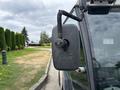 A side mirror of a 2019 Madvac LS175 with a flexible arm attached to a vehicle