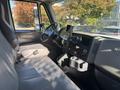 Interior view of a 2008 International 4400 truck showing the driver's seat dashboard and controls