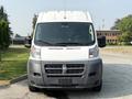 Front view of a 2017 RAM Promaster van featuring a white body with a gray lower section and a distinctive grille with the RAM logo