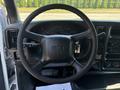 Steering wheel of a 2005 GMC C7500 Topkick featuring a black leather cover and control buttons on the side
