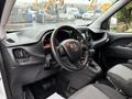 Interior view of a 2017 RAM ProMaster City featuring a steering wheel dashboard and gear shift with fabric seats