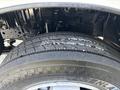 A close-up of a worn tire on a 2018 Hino 195 showing visible tread damage and cracks on the surface