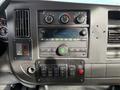 Dashboard of a 2019 Chevrolet Express with control knobs a radio display and various switches
