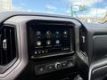 A dashboard display of a 2019 Chevrolet Silverado 1500 featuring touch screen controls for audio phone settings and navigation