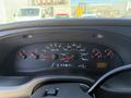 Dashboard of a 2006 Ford Econoline displaying various gauges including speedometer fuel gauge and engine RPM