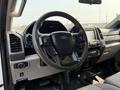 Interior view of a 2020 Ford F-350 SD showing the steering wheel and dashboard with controls and displays