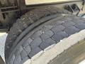 Close-up of a dual tire from a 2015 Ford F-750 showing tread wear and detailed surface texture