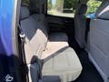Interior view of the back seat of a 2017 Chevrolet Silverado 1500 with gray fabric upholstery and three seating positions