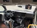 Interior view of a 2018 Chevrolet Express showing the dashboard controls steering wheel and driver's seat