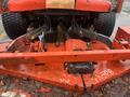 A 2010 Kubota F3680 with a red mowing deck and attached hydraulic systems visible underneath the rear of the tractor